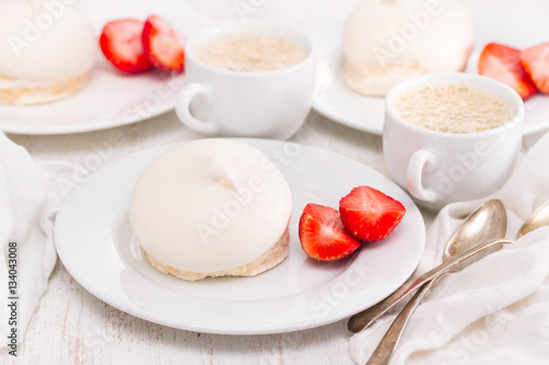 meringue with strawberries on plate