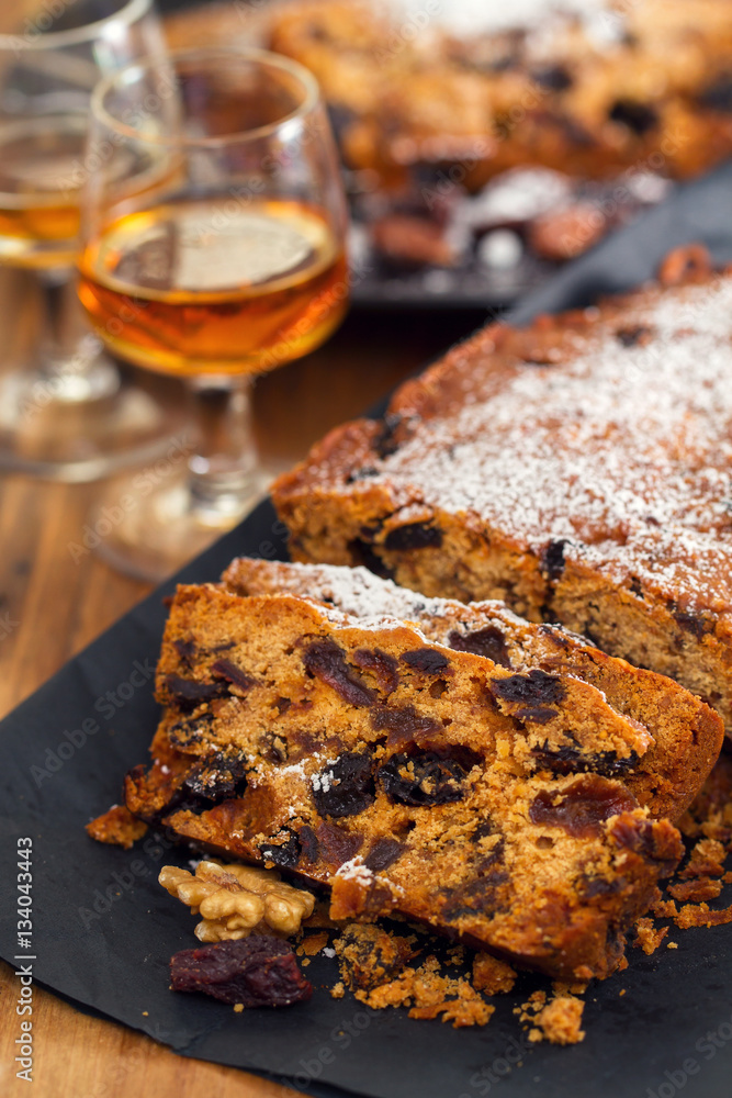English cake with dry fruits on plate English cake with dry fruits on plate
