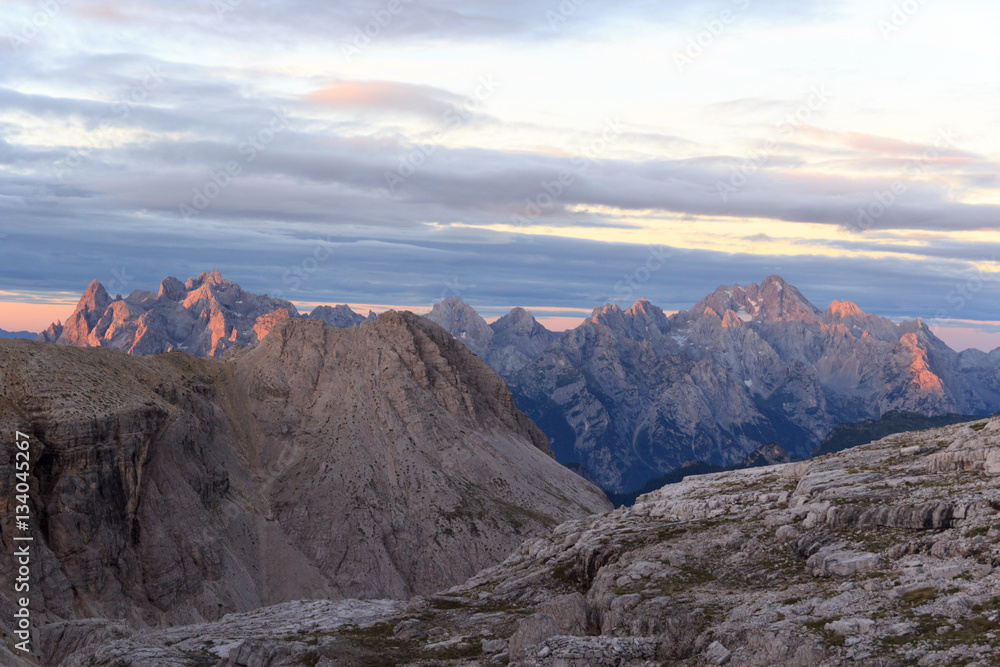 Sexten Dolomites mountains panorama with Alpenglow at sunrise in South Tyrol, Italy