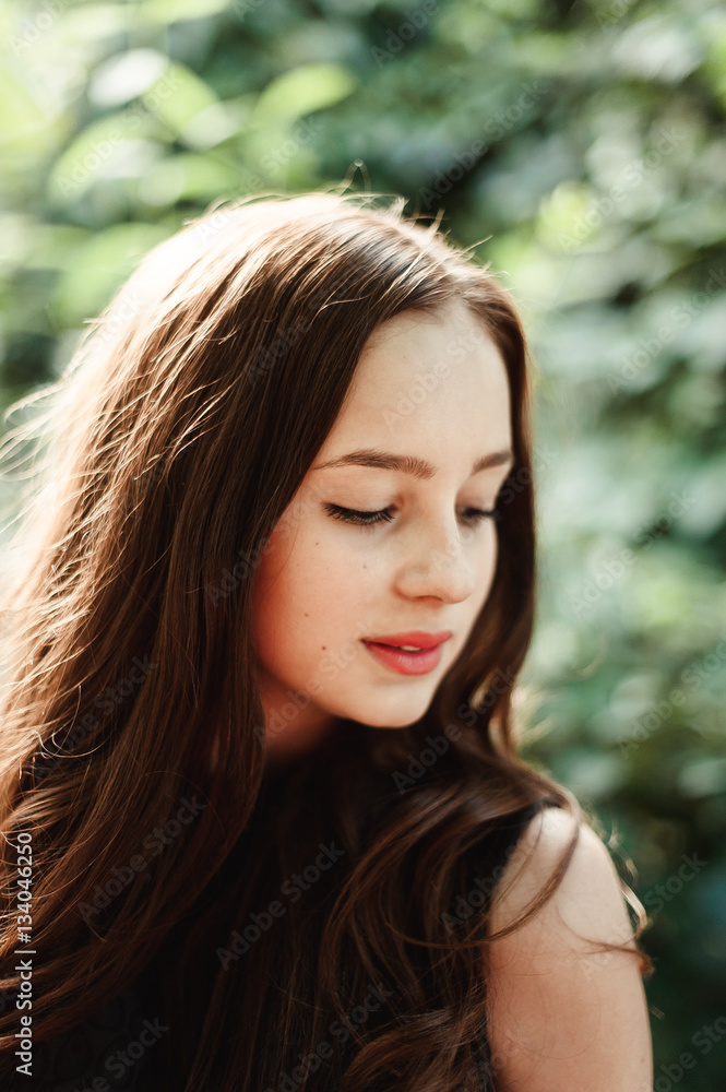 Beautiful young girl in black dress with long hair, super cute a Beautiful young girl in black dress with long hair, super cute a