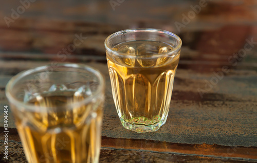 whiskey in a glass  on wood table