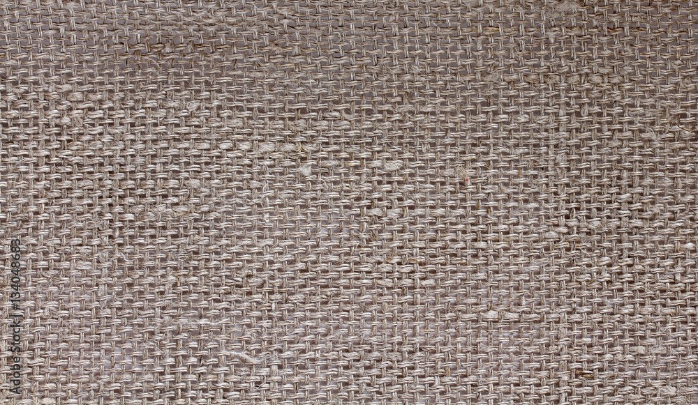 background of coarse linen with a texture of threads and weaves