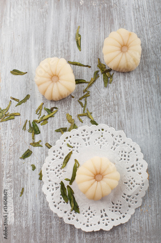 Green tea mochi - Japanese mini rice cake on a white decorative doily 