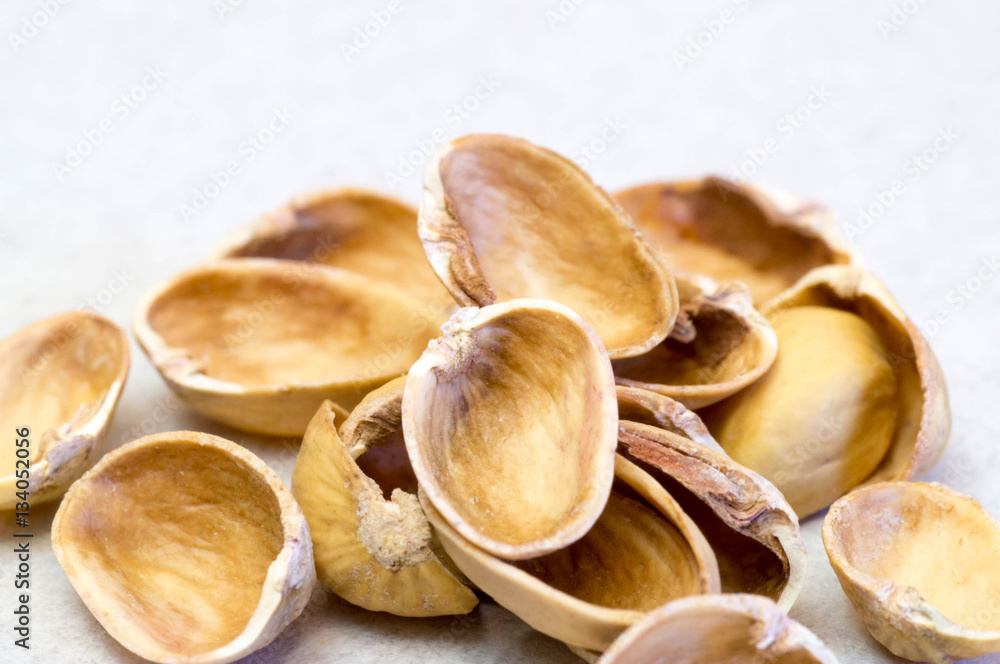 Empty pistachio nut shells on each other Empty pistachio nut shells on each other