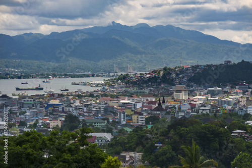 Ambon City, Indonesia. Ambon City on Ambon Island boasts excellent transport connections and facilities and make it a gateway to Maluku, and its colonial forts, green hills and pleasant beaches. © LoweStock