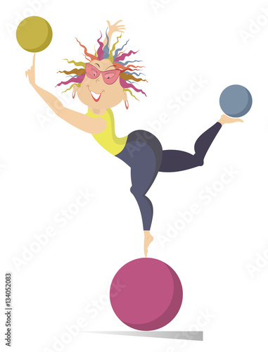 Woman do exercises with the balls. Funny young woman standing on the ball holds others on the finger and on the leg
