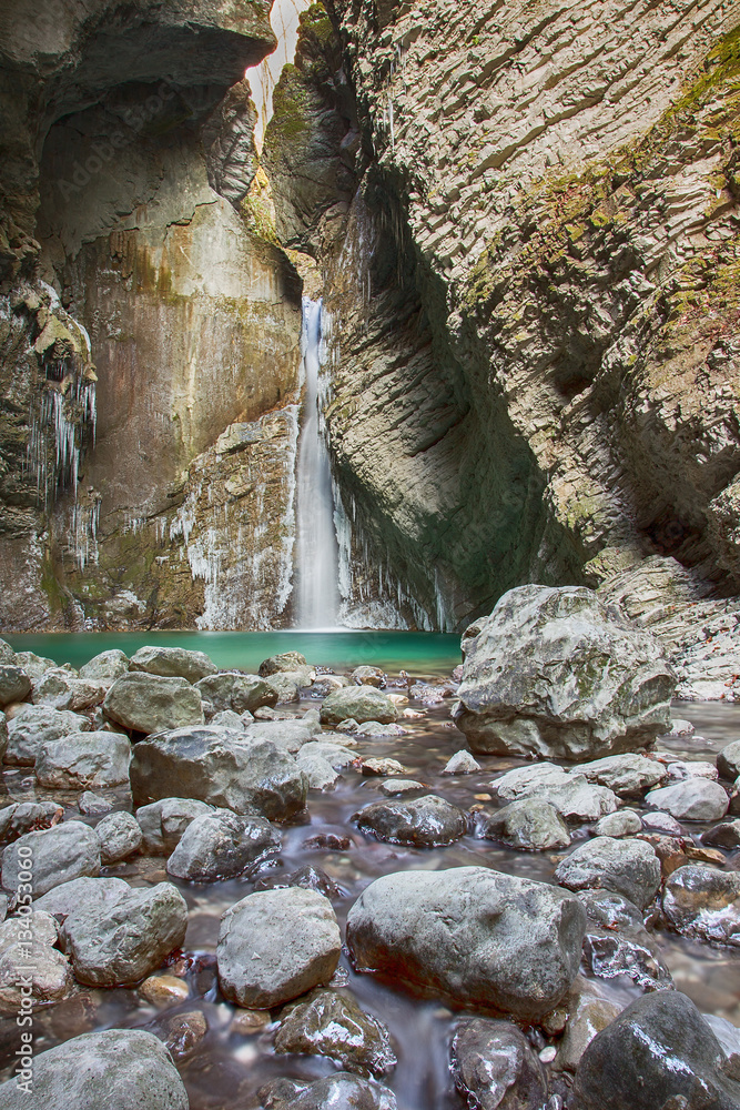 Beautiful frozen waterfall Kozjak Slovenia in winter - long exposure
