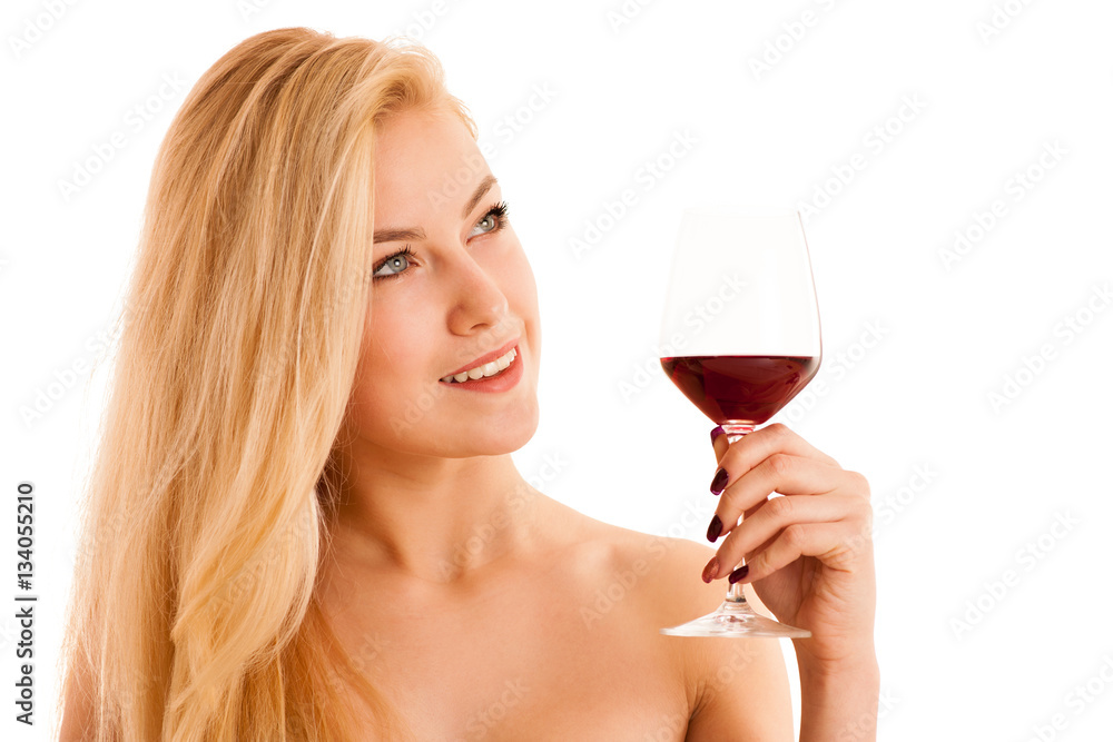 Cute blonde woman drinks a glass of red wine isolated over white Cute blonde woman drinks a glass of red wine isolated over white