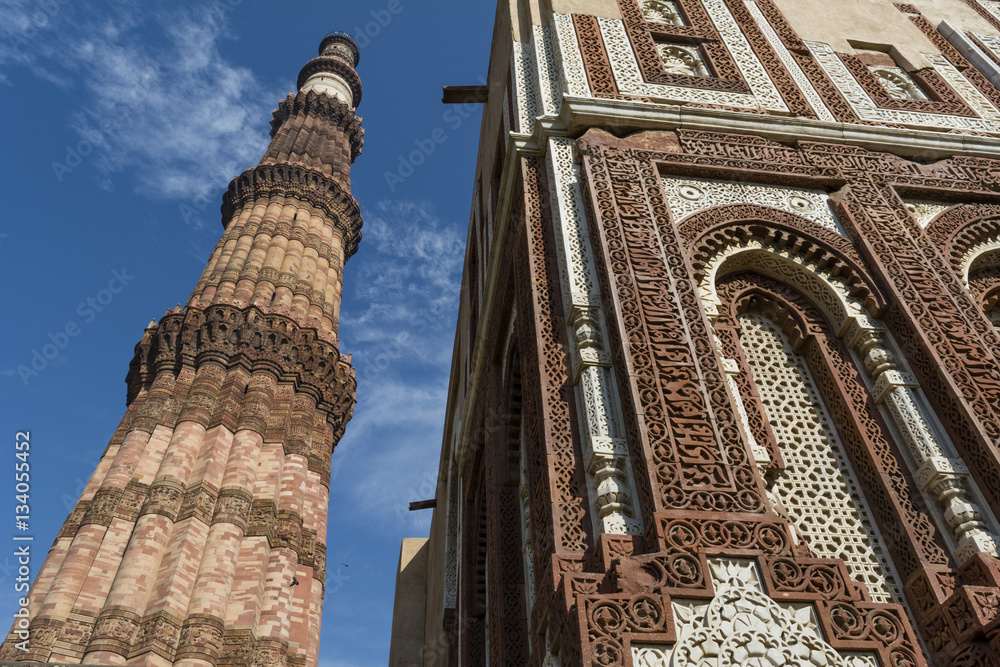 Qutub Minar and intricate inlay work on Alai Darwaza inside Qutb complex in Mehrauli, Delhi, India, Asia.