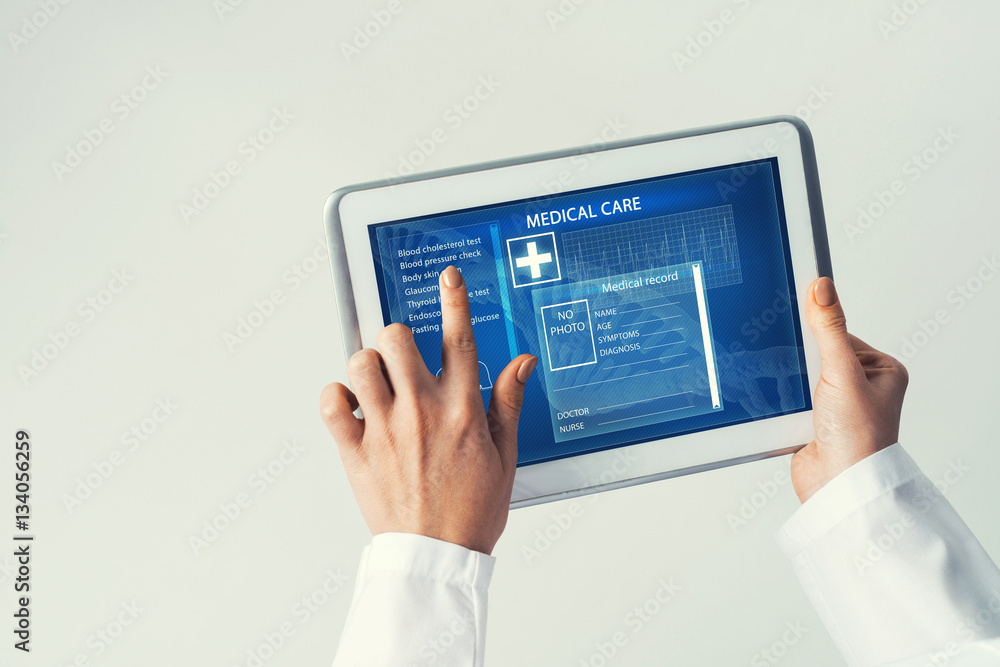 Close of female doctor hands working with tablet pc computer Close of female doctor hands working with tablet pc computer