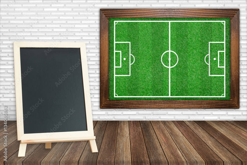Fototapeta premium grass soccer field with blackboard on floors