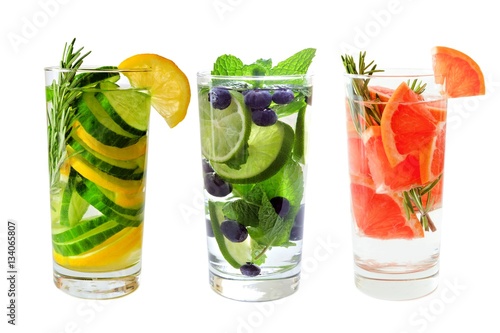 Bilde på lerret Three types of fruit detox water in glasses isolated on a white background