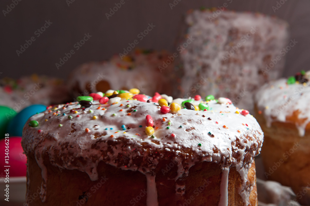 Easter cakes in the glaze and candy strewing, close-up Easter cakes in the glaze and candy strewing, close-up