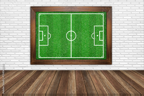 green grass soccer field background with wood floors