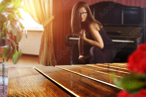 wooden table of free space and woman in black dress 