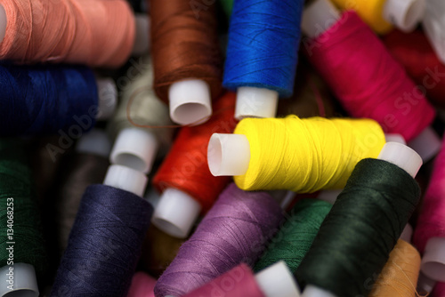 Many reels of threads for embroidery. Colorful macro background.