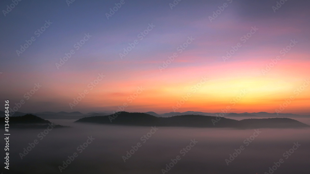Soft focus sunrise at mist on the mountain