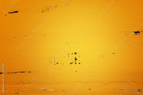 Yellow rustic wood background, with applied dark vignette filter