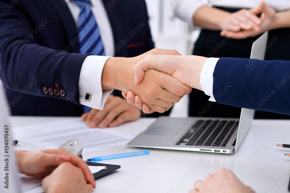 Fototapeta premium Business handshake at meeting or negotiation in the office. Partners are satisfied because signing contract or financial papers