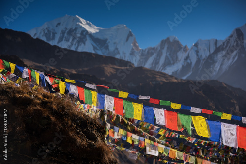 Prayer flags and snow mountain range background from Annapurna Base Camp ,Nepal.