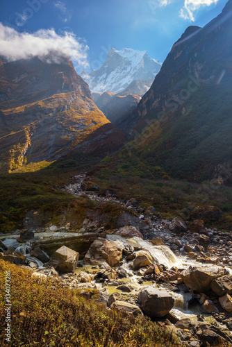 Mt .Machapuchare and waterfall ,Nepal. photo