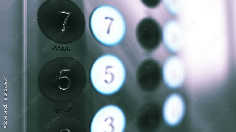 Elevator Button Panel Close up with Floors lighting up on an ambient corporate setting Elevator Button Panel Close up with Floors lighting up on an ambient corporate setting