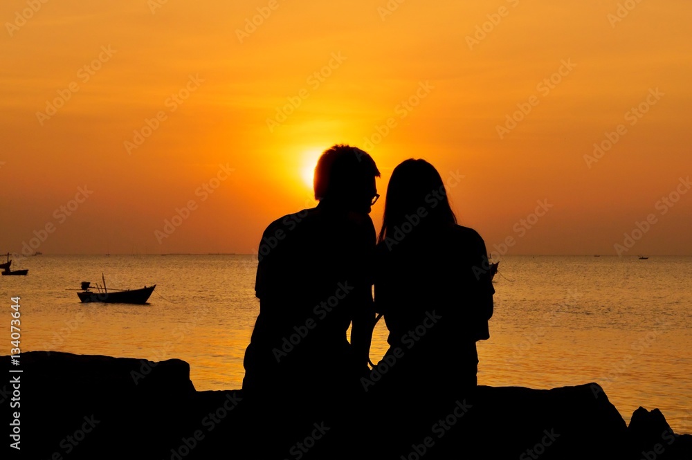 Romantic couple sitting on the beach at sunset Stock Photo | Adobe Stock Romantic Couple Sitting On The Beach At Sunset Stock Photo | Adobe Stock