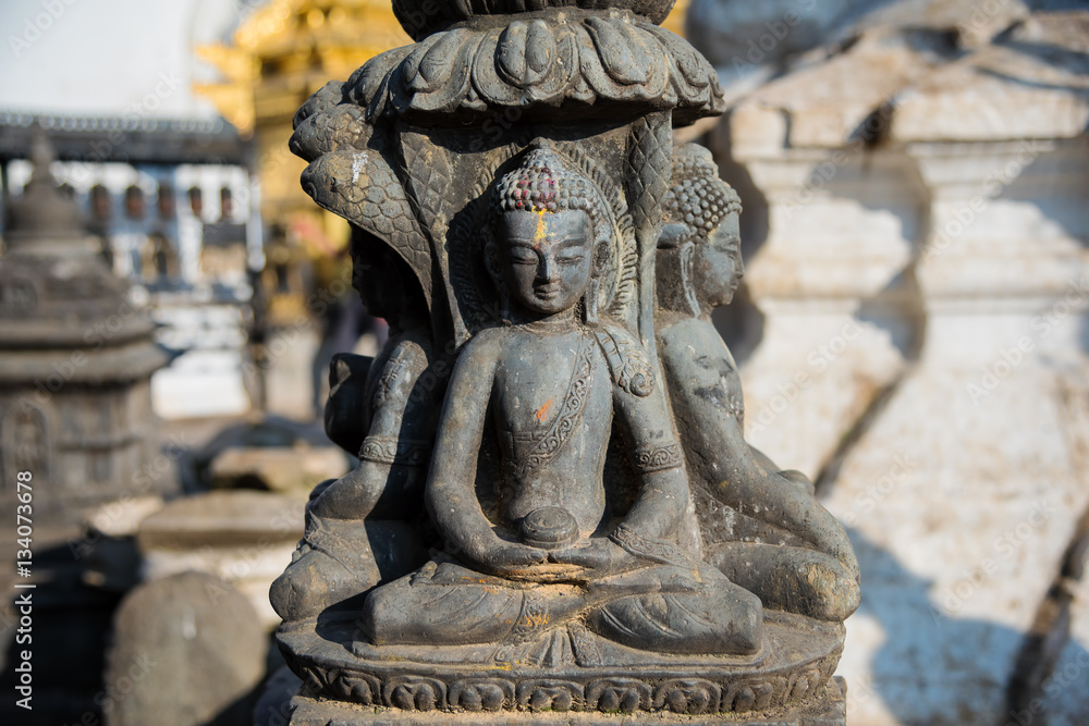 Stone buddha statue in Swayambhunath temple ,Kathmandu, Nepal. Stone buddha statue in Swayambhunath temple ,Kathmandu, Nepal.