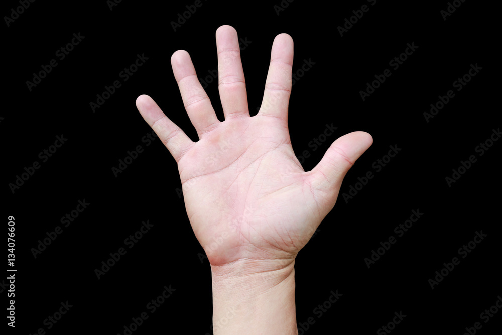 A hand shows in signal of paper or number five on black background. A hand shows in signal of paper or number five on black background.