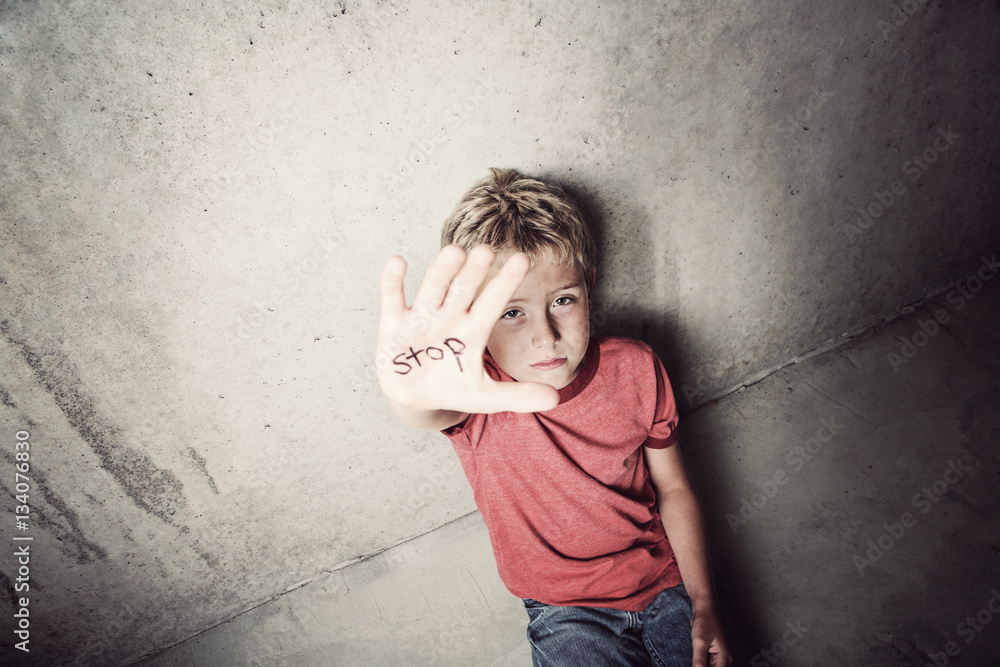 Stop abuse. Focus on boy's face. Stop abuse. Focus on boy's face.