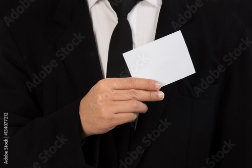 Businessman holding a piece of blank card