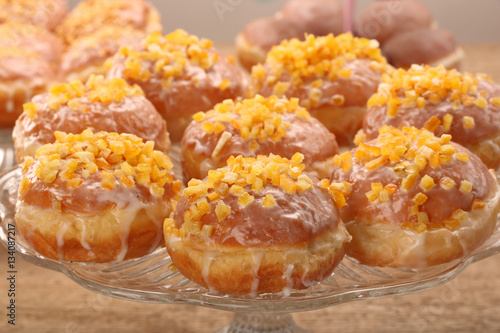 Traditional Polish homemade donuts with rose liqueur and orange