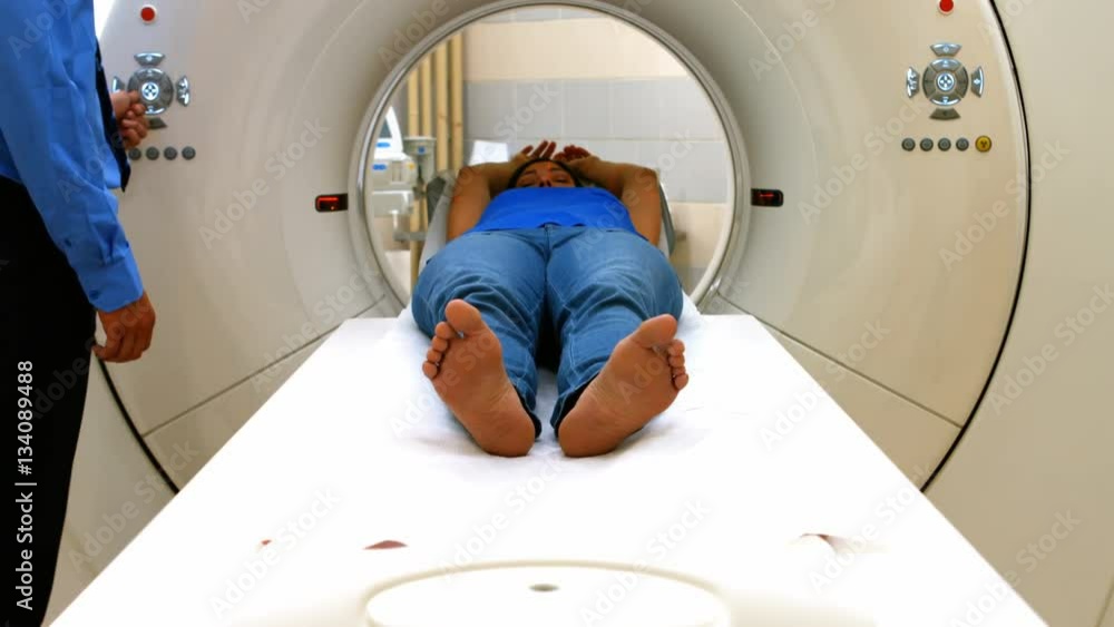 A patient is loaded into an mri machine A patient is loaded into an mri machine