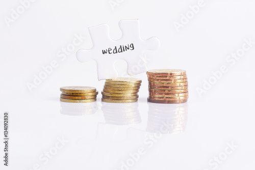 White missing puzzle and gold coins with wedding,copyspace area.