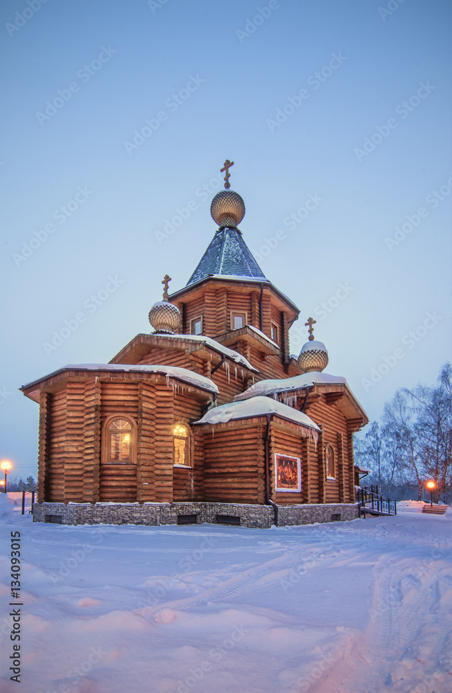 background with frosty winter morning and old rural wooden chape