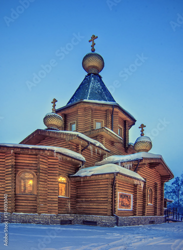 Obraz na płótnie winter night landscape with old rural wooden Church with lightni w salonie