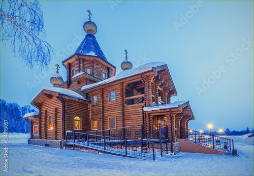Obraz na płótnie winter night landscape with old rural wooden Church with lightni w salonie