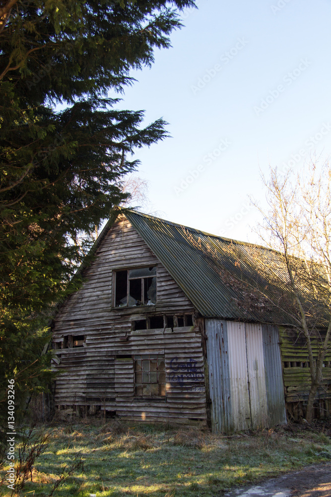 Old derelict empty wooden barn in country Old derelict empty wooden barn in country