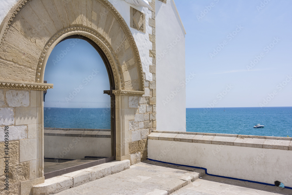Mediterranean sea reflected in a window