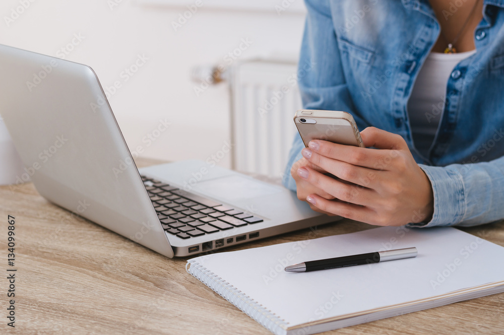 © bnenin - Side view of business woman hand checking mail on her smart phon