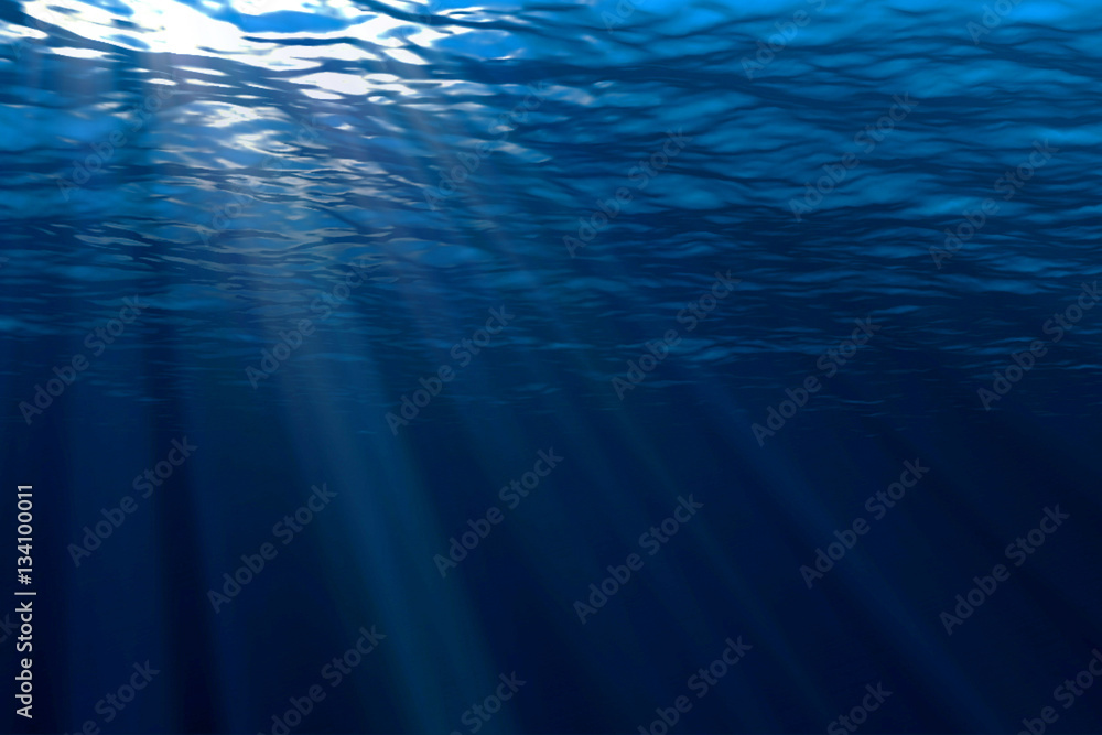 deep blue ocean waves from underwater background, light rays