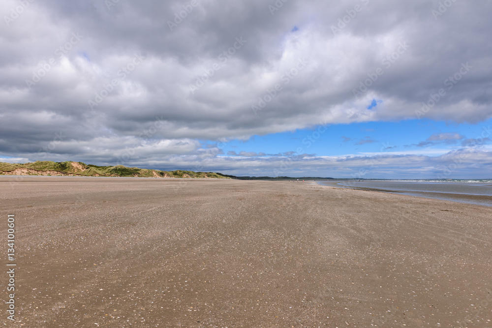 Scenic view of beach against blue cloudy sky, Murlough Beach, Newcastle, Northern Ireland