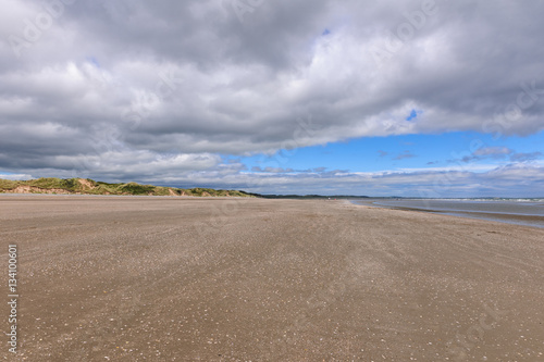 Scenic view of beach against blue cloudy sky  Murlough Beach  Newcastle  Northern Ireland