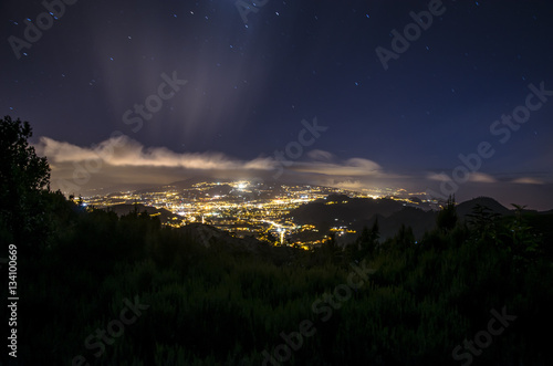 Night view Tenerife with shining clouds