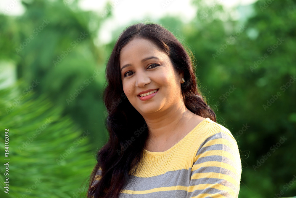Smiling young woman at outdoors