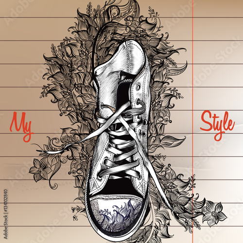 Boots with ornament on a paper sheet