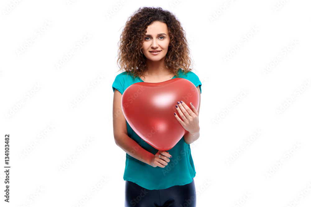 Beautiful and young girl holding balloons in the shape of a heart. The concept of Valentine's Day Beautiful and young girl holding balloons in the shape of a heart. The concept of Valentine's Day