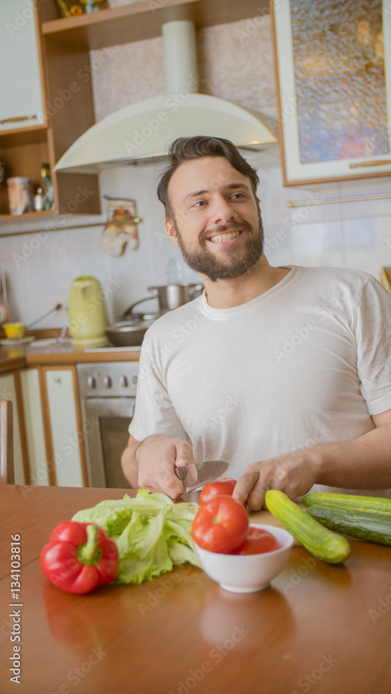 a man cooks in the kitchen a man cooks in the kitchen