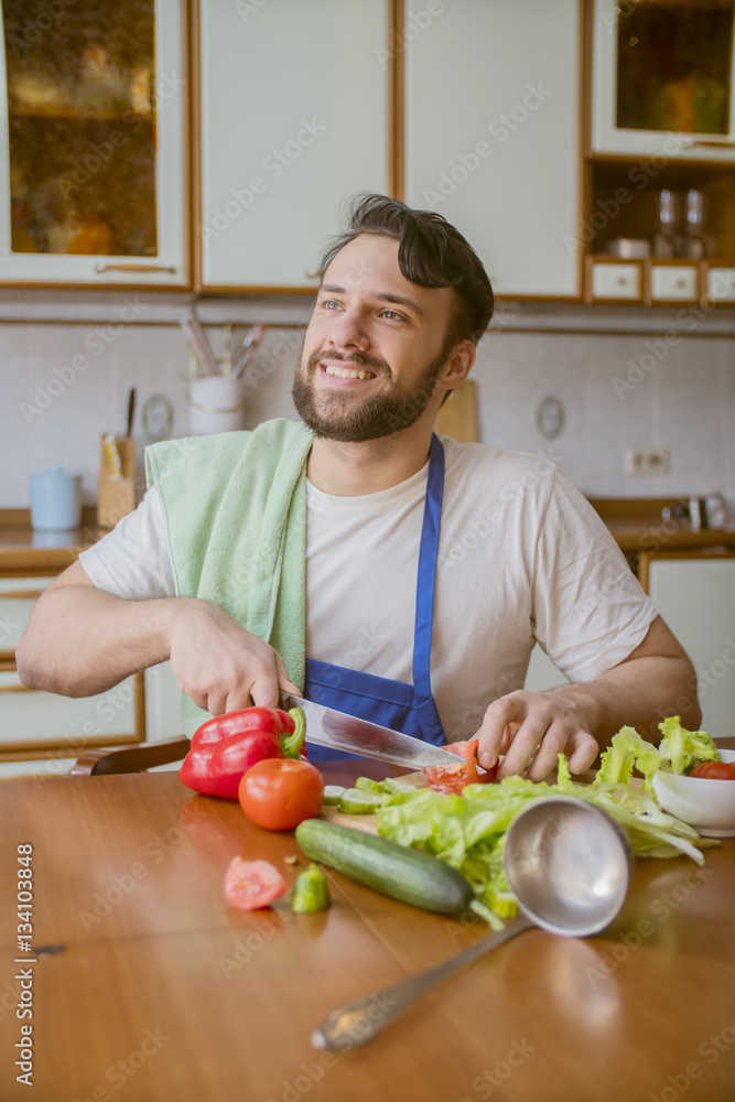 a man cooks in the kitchen a man cooks in the kitchen
