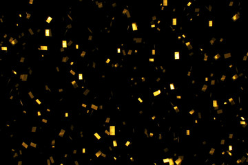 falling gold glitter foil confetti,  on black background, holiday and festive fun